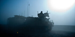 A Warthog Armoured Vehicle is silhouetted in the early morning Afghanistan sun. Photo: Corporal Andy Reddy RLC